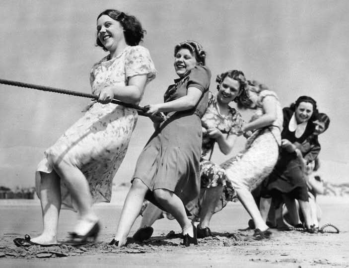 The Tug-of-War at Coney Beach: A Slice of 1939 Seaside Joy The year 1939 was a monumental one in history, with the clouds of World War II beginning to cast their shadows across Europe. Yet, amidst these uncertain times, life at the seaside thrived, providing moments of joy and togetherness.